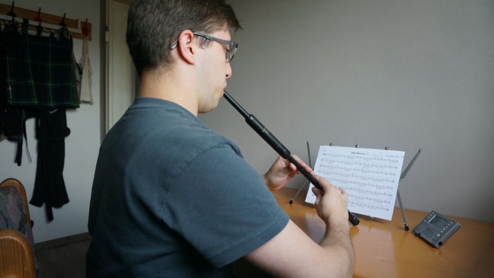 Max Beck plays a practice chanter.